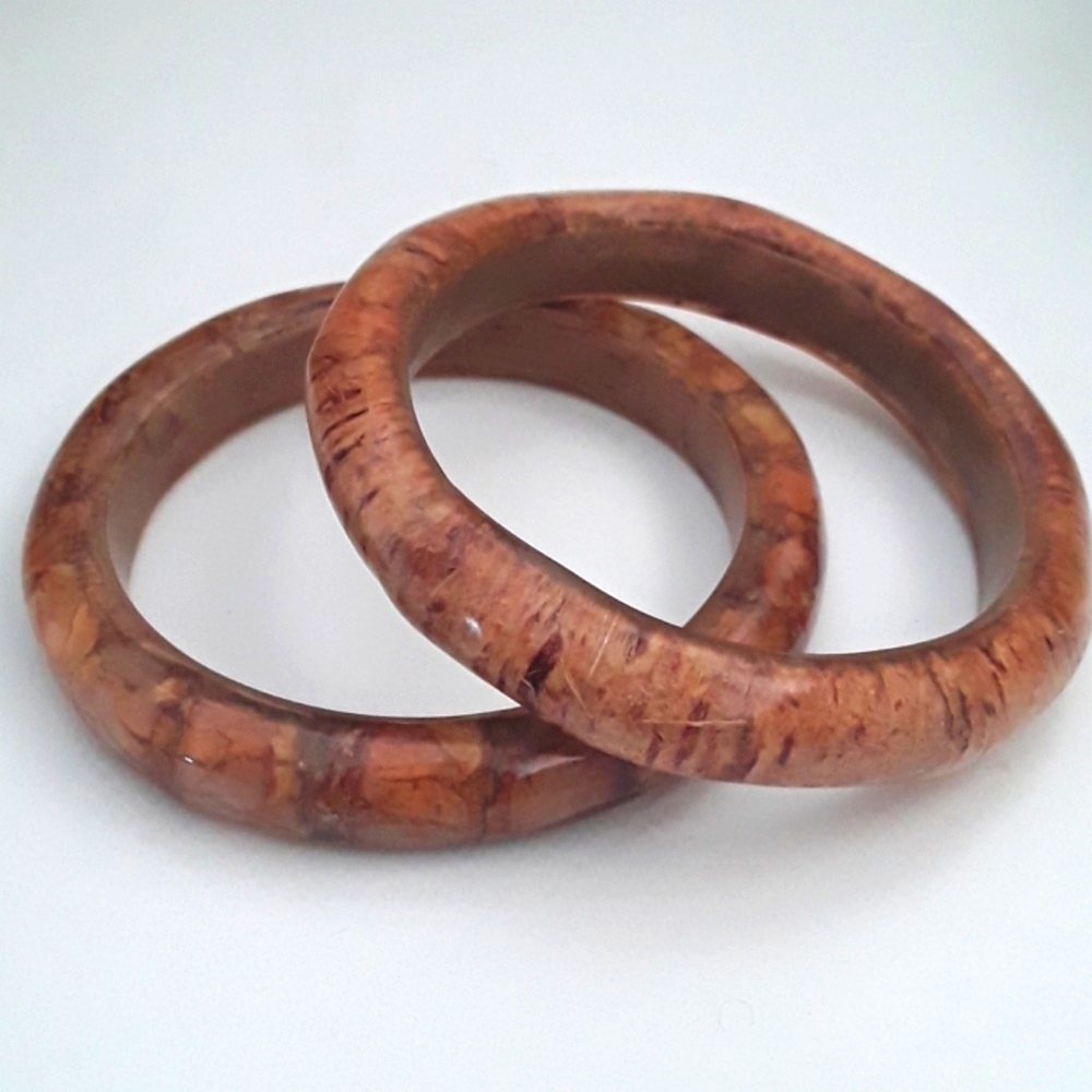 TWO POLISHED WOODEN BRACELETS